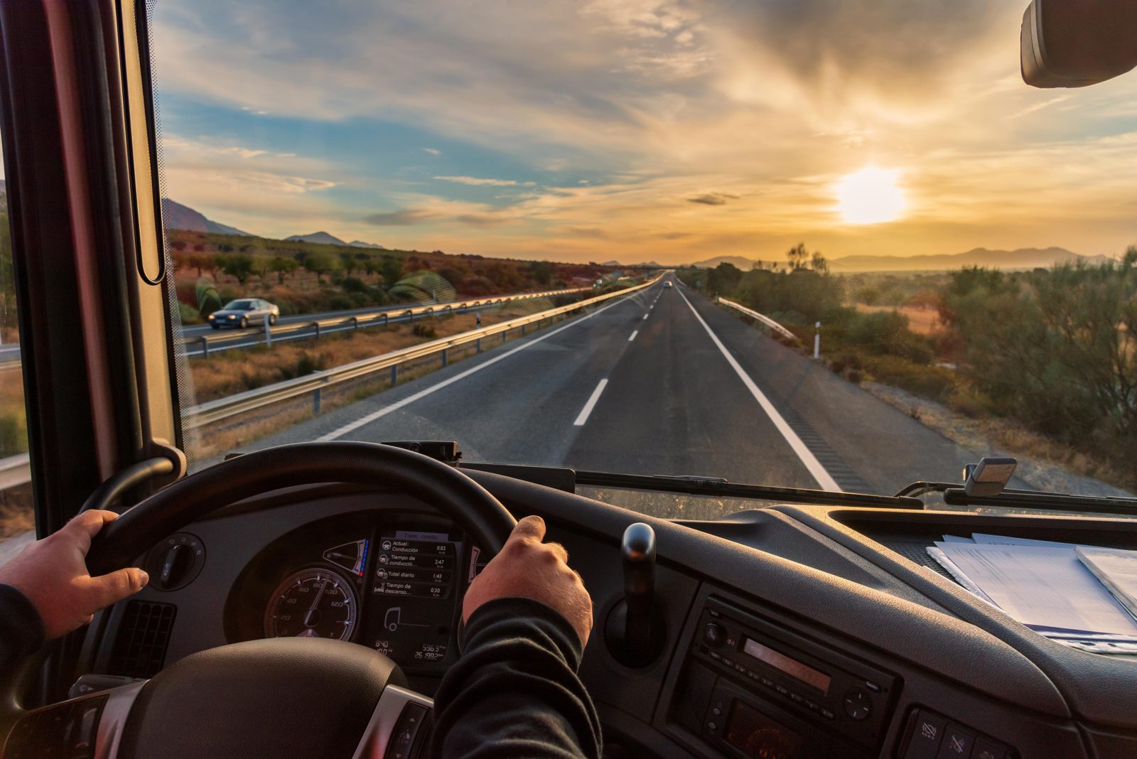 A driver’s view of the open highway from the cab of a truck